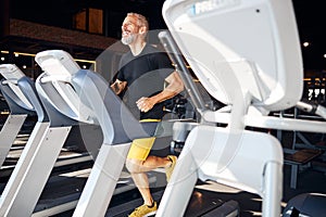 High-spirited male runner enjoying his cardio workout