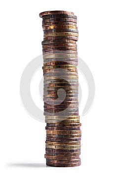 High stack of copper coins isolated on white