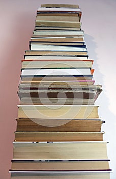 High stack of old books. Selective focus.