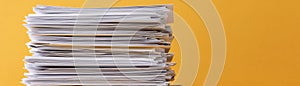 High Stack of Papers Documents Office Work Yellow Background