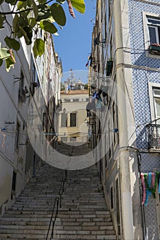 High steep step stairs on Lisbon street in Mouraria district photo