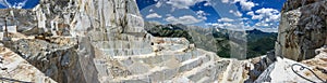 High stone mountain and marble quarries in the Apennines in Tuscany. Open marble mining photo