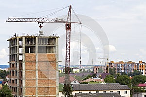 High storey building under construction with tower crane and workers men