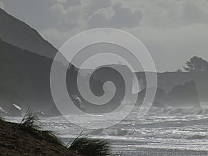 High surf on beach and rocks