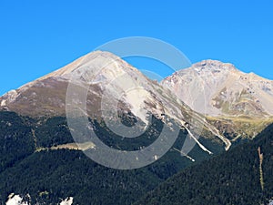 High swiss alpine peaks Piz Linard (2767 m) and Lenzerhorn (2906 m) above the river Albula or Alvra