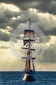 High tall pirate ship leaving the harbor of Scheveningen
