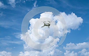 A high-tech drone in the sky Professional filming drone flies in the air at a low altitude against a blue sky and sea sandy beach