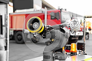 High-tech firefighting robot with a hose for extinguishing fires