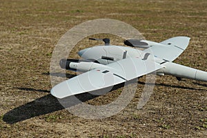 high tech uav plane about to perform its flight on a mission, on the ground