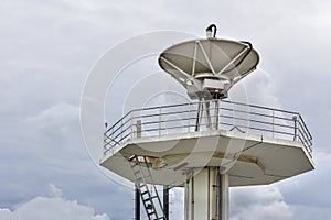 High technology satellite dish station on cloudy sky day background