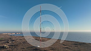 High telecommunication antenna tower. Radio military tower