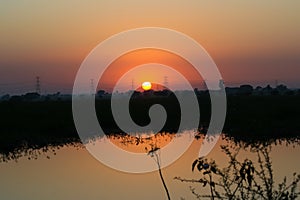 High Tension Electricity Power Lines and Sunset