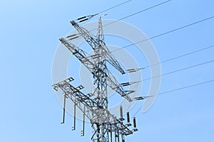 High-tension power line tower carries green electricity energy