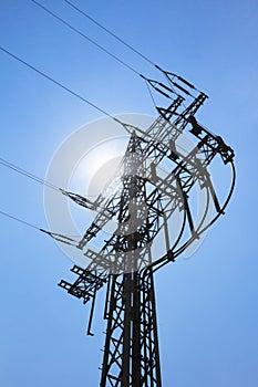 High-tension power line tower carry green electricity sun energy