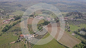 High view from drone of mountains village in Italy in sunny weather in summer, wineries and olive oil home productions