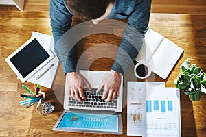 High view of man working on laptop