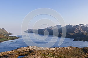 High view of Norwegian Sea blending with Lofoten\'s sharp mountains and coast