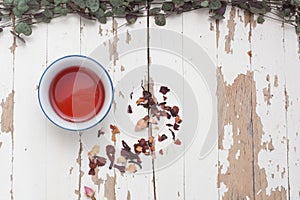 A high view of Rosehip Tisane in a cup with loose leaves