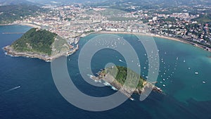 High view of San-Sebastian with Beach of La Concha and boats at sea, Spain