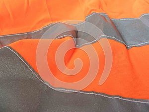 High visibility orange jacket as background