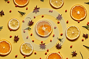 High vitamin C. Fresh orange and lemon citrus fruit with flowers isolated on yellow background.
