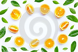 High vitamin C, Juicy and sweet. Frame made of fresh orange fruit with green leaves on white background
