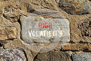 High volatility symbol. Concept words High volatility on beautiful big stone. Beautiful stone wall background. Business high