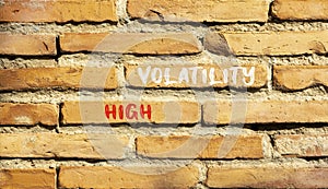 High volatility symbol. Concept words High volatility on beautiful brick wall. Beautiful red brown brick wall background. Business