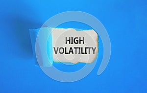 High volatility symbol. Concept words High volatility on beautiful white paper. Beautiful blue paper background. Business high