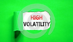 High volatility symbol. Concept words High volatility on beautiful white paper. Beautiful green paper background. Business high