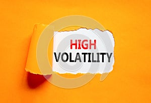 High volatility symbol. Concept words High volatility on beautiful white paper. Beautiful orange paper background. Business high