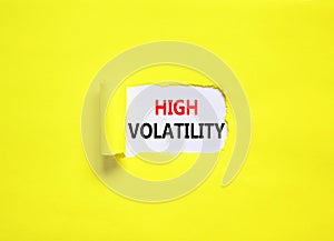 High volatility symbol. Concept words High volatility on beautiful white paper. Beautiful yellow paper background. Business high