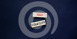 High volatility symbol. Concept words High volatility on beautiful wooden blocks. Beautiful black table black background. Business