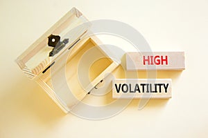 High volatility symbol. Concept words High volatility on beautiful wooden blocks. Beautiful white table white background. Empty