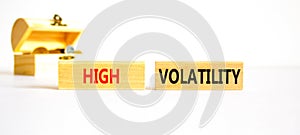 High volatility symbol. Concept words High volatility on beautiful wooden blocks. Beautiful white table white background. Wooden