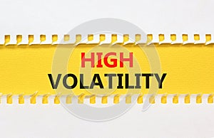 High volatility symbol. Concept words High volatility on beautiful yellow paper. Beautiful white table white background. Business