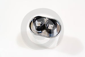 High-voltage capacitor on a white background. Part from the microwave. photo