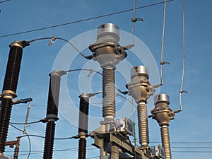 High voltage current transformers and circuit breaker at blue sky background photo