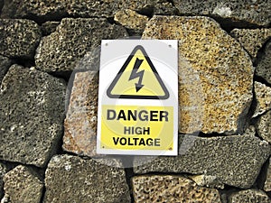 High voltage danger yellow sign