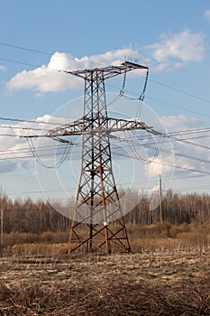 High-voltage electric main against the dark blue sky