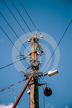 High voltage electric pole and transmission lines with clear blue sky. Electricity pylons. Power and energy engineering system. Da