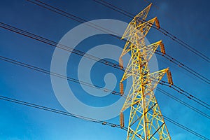High voltage electric pole and transmission lines in the evening. Electricity pylons at night. Power and energy. Energy