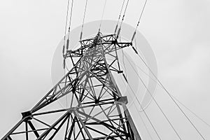 High voltage electric power steel tower in the evrning time, closeup of photo