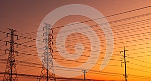 High voltage electric pylon and electrical wire with sunset sky. Electricity poles. Power and energy support factory concept. High