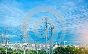 High voltage electric tower line. Silhouette of Power Supply Facilities with blue sky background