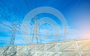 High voltage electric tower line. Silhouette of Power Supply Facilities with blue sky background