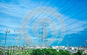 High voltage electric tower line. Silhouette of Power Supply Facilities with blue sky background