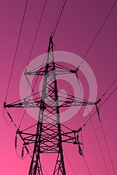 High voltage electric tower silhouette on bright pink background
