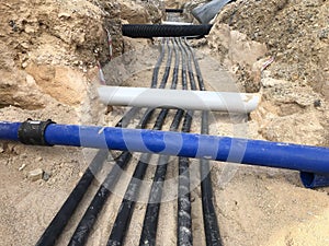 The high voltage electrical cable is laid in a trench