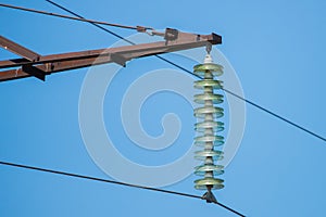 High-voltage electrical insulator electric line against the blue sky